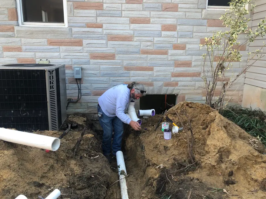 Exterior sewer line work at a Maryland property