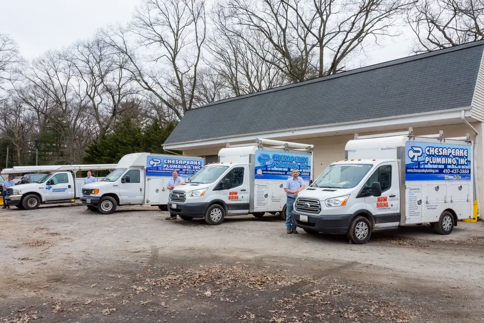 Chesapeake Plumbing fleet of four branded service trucks with three technicians